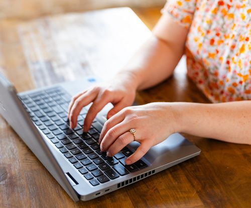 Our Hidden Hive WI – Typing on Laptop Our Hidden Hive WI - Typing on Laptop